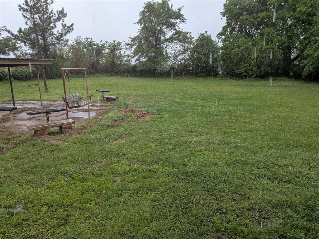 2009 County Road 4619 Athens, TX 75752 - Photo 32 of 36 View of grassy yard with a patio area