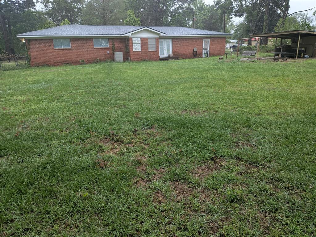 2009 County Road 4619 Athens, TX 75752 - Photo 7 of 36 a view of a house with a yard and sitting area