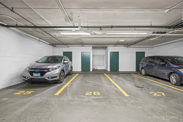 a view of parking garage with cars parked