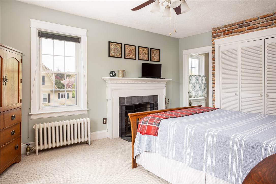 5359 Post Road East Greenwich, RI 02818 - Photo 20 of 38 Master bedroom with wood burning fireplace.