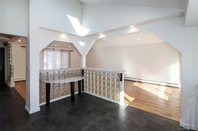 a white toilet sitting next to a bathroom sink