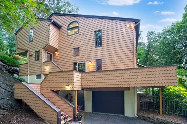 a front view of a house with stairs