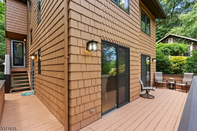 a view of a hallway with paintings on the wall