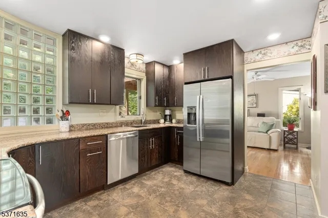 a view of a hallway with paintings on the wall