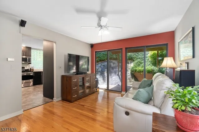 a view of balcony with wooden floor and outdoor seating