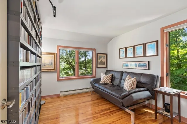a view of staircase with railing and white walls