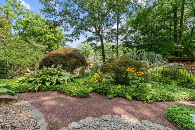 an aerial view of a houses with yard