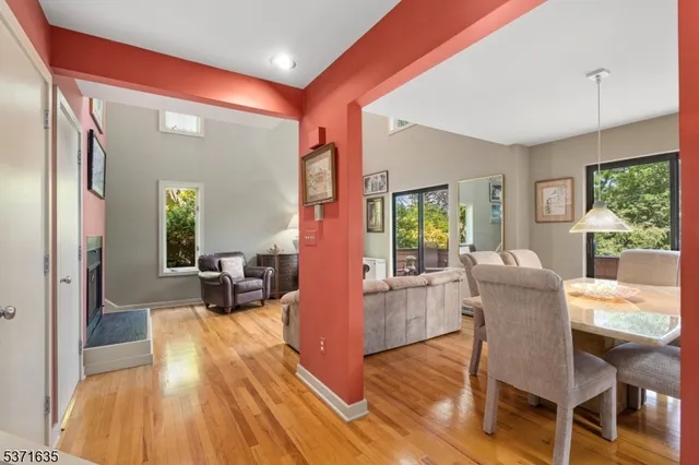 a view of a livingroom with furniture window and wooden floor