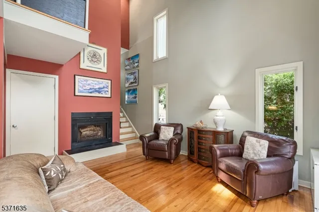 a living room with furniture window and a fireplace