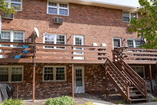 a front view of a building with many windows