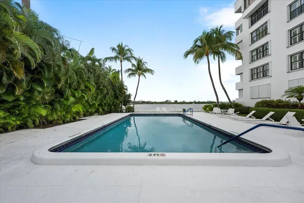 a view of swimming pool with chairs