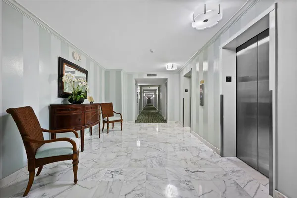 a view of a hallway with seating area