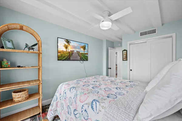 a bedroom with a bed and a dresser