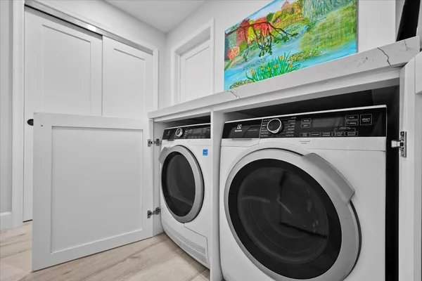 a utility room with dryer and washer