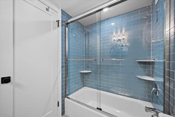 a bathroom with a shower and bathtub