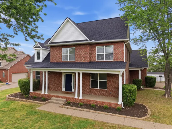 front view of a house with a yard