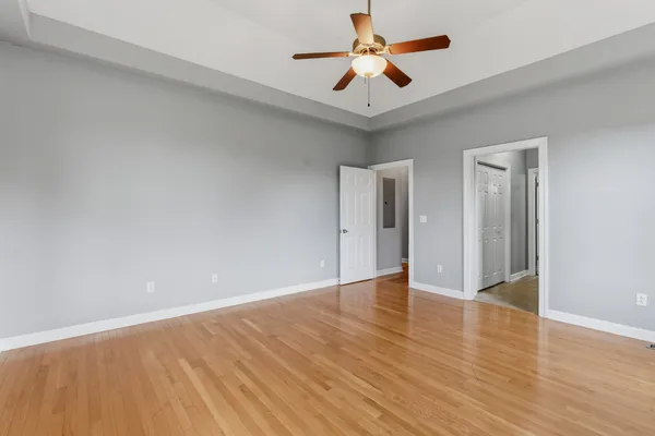 a spacious bathroom with a tub double sink window and mirror