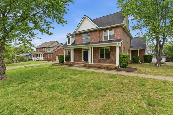 front view of a house with a yard