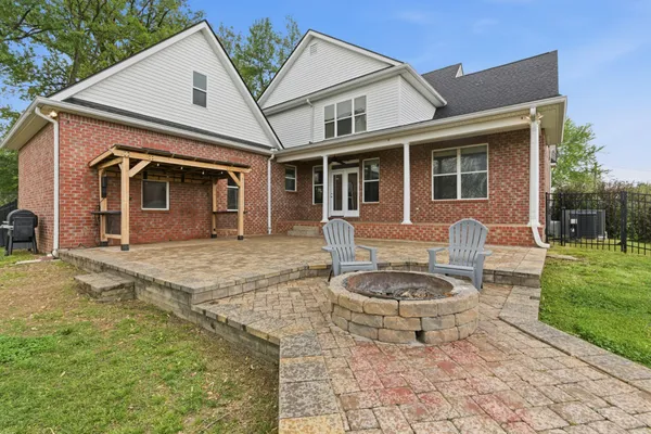 a house that has sitting area in front of it