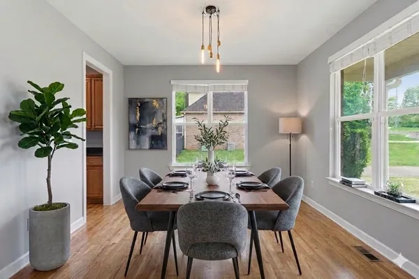 a view of a dining room with furniture window and outside view