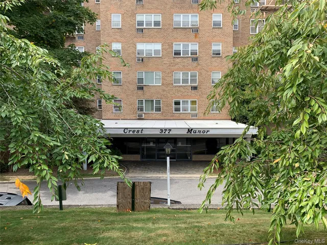 a view of a house with pool and a yard