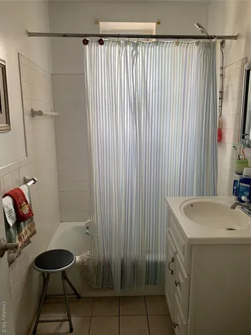 a view of a swimming pool with a yard