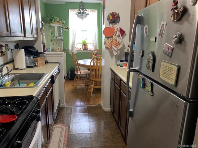 a bedroom with a bed dresser and a window