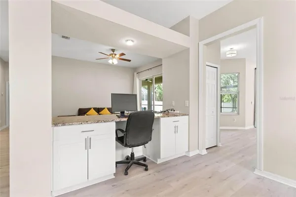 a view of workspace with a window and cabinet