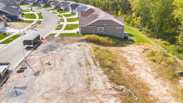 an aerial view of residential house with outdoor space and swimming pool