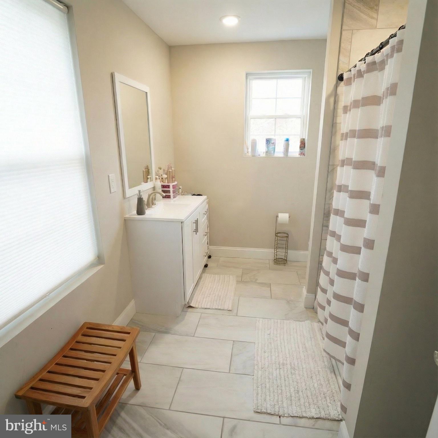 10 West Monroe Street Mount Holly, NJ 08060 - Photo 13 of 16 a bathroom with a sink a toilet and shower
