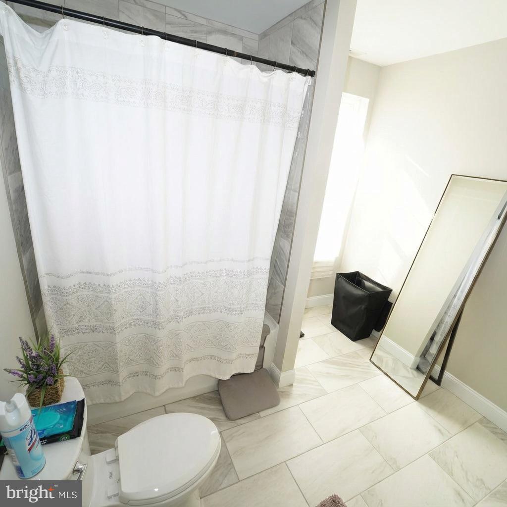10 West Monroe Street Mount Holly, NJ 08060 - Photo 8 of 16 a bathroom with a toilet and a shower