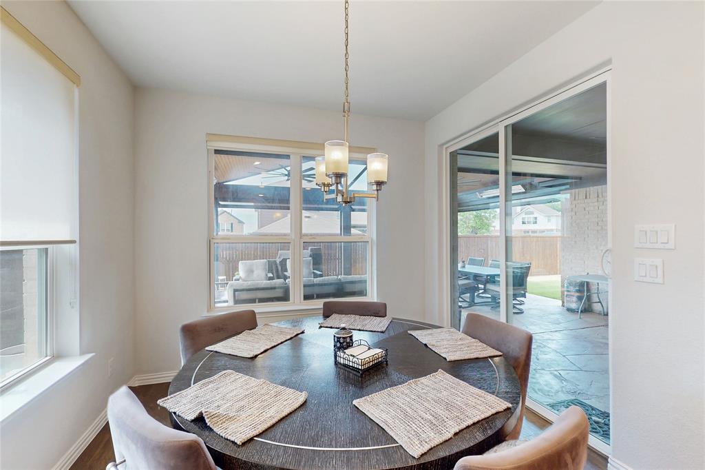 1997 Kieva Place Allen, TX 75013 - Photo 12 of 40 Dining room with hanging lights and baseboards