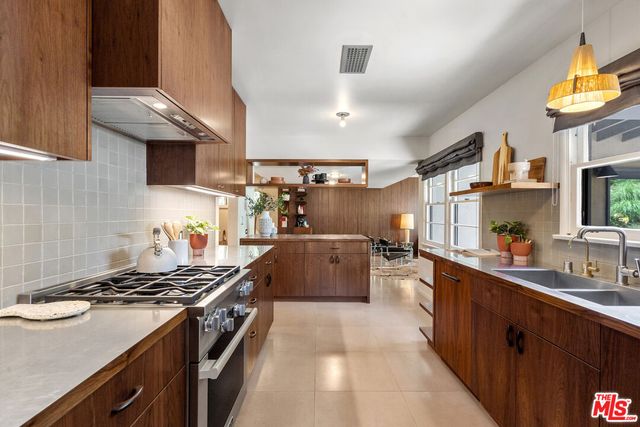 a kitchen with a stove and a sink
