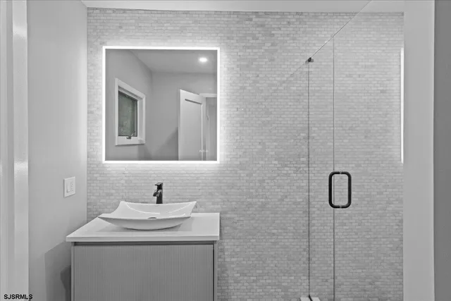 a white toilet sitting next to a bathroom sink