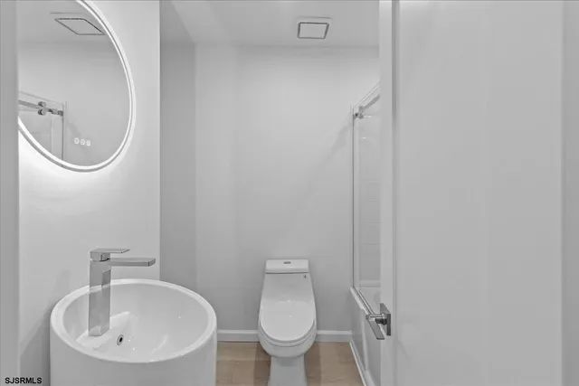 a bathroom with a toilet and a sink