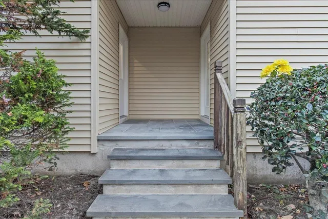 a view of entryway with a front door