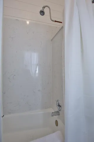 a bathroom with a bathtub