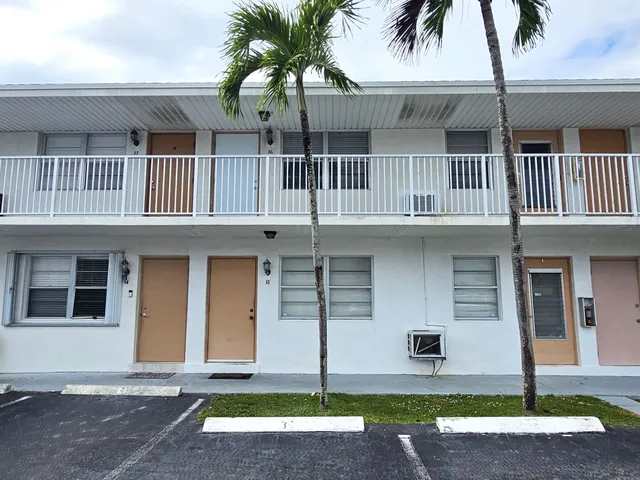 a front view of a house with garage