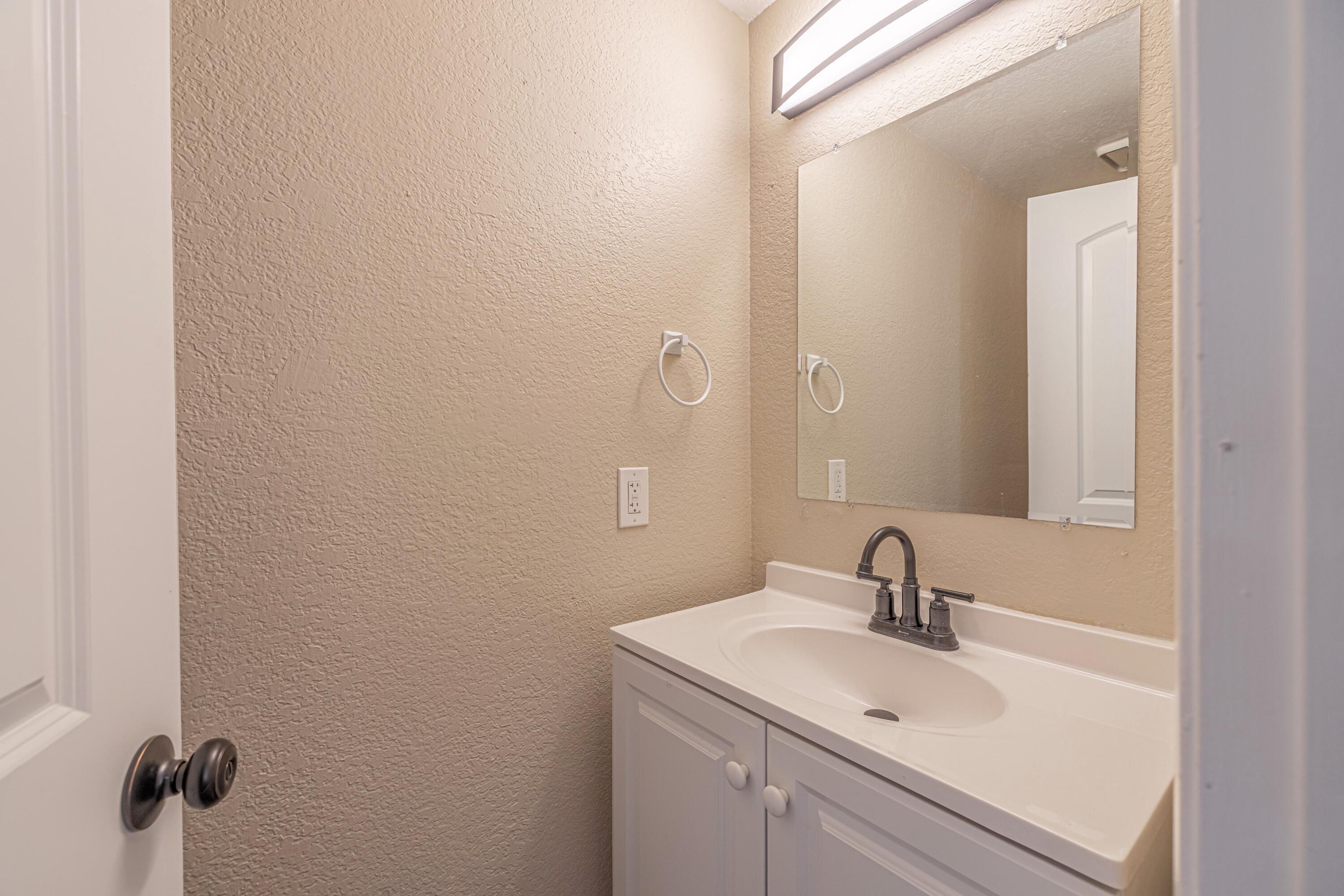 533 East Jackman Street Lancaster, CA 93535 - Photo 14 of 31 a bathroom with a sink and mirror