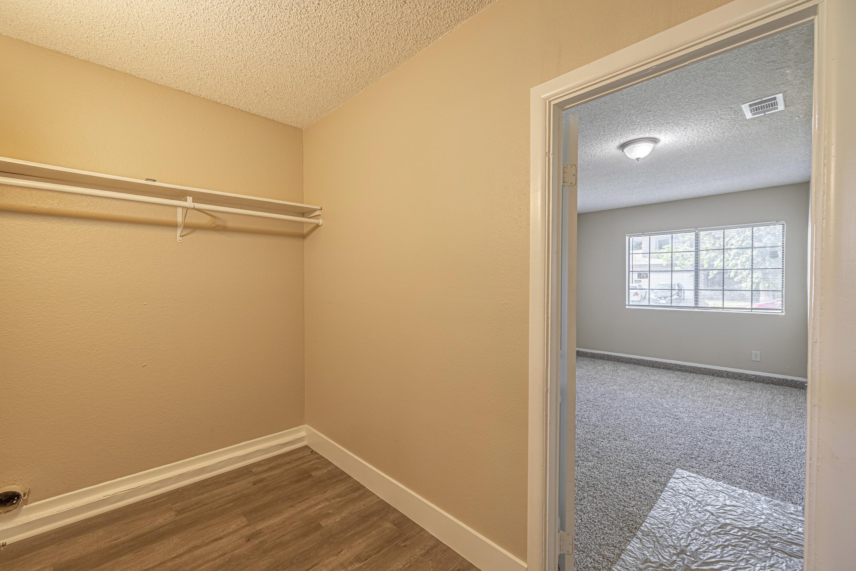 533 East Jackman Street Lancaster, CA 93535 - Photo 15 of 31 a view of an empty room with wooden floor and a window