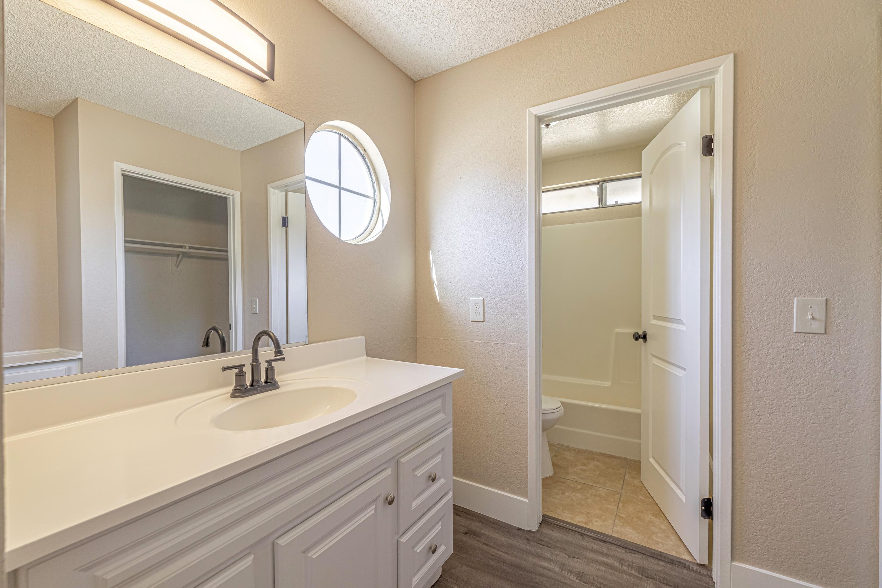 533 East Jackman Street Lancaster, CA 93535 - Photo 21 of 31 a bathroom with a sink and a mirror