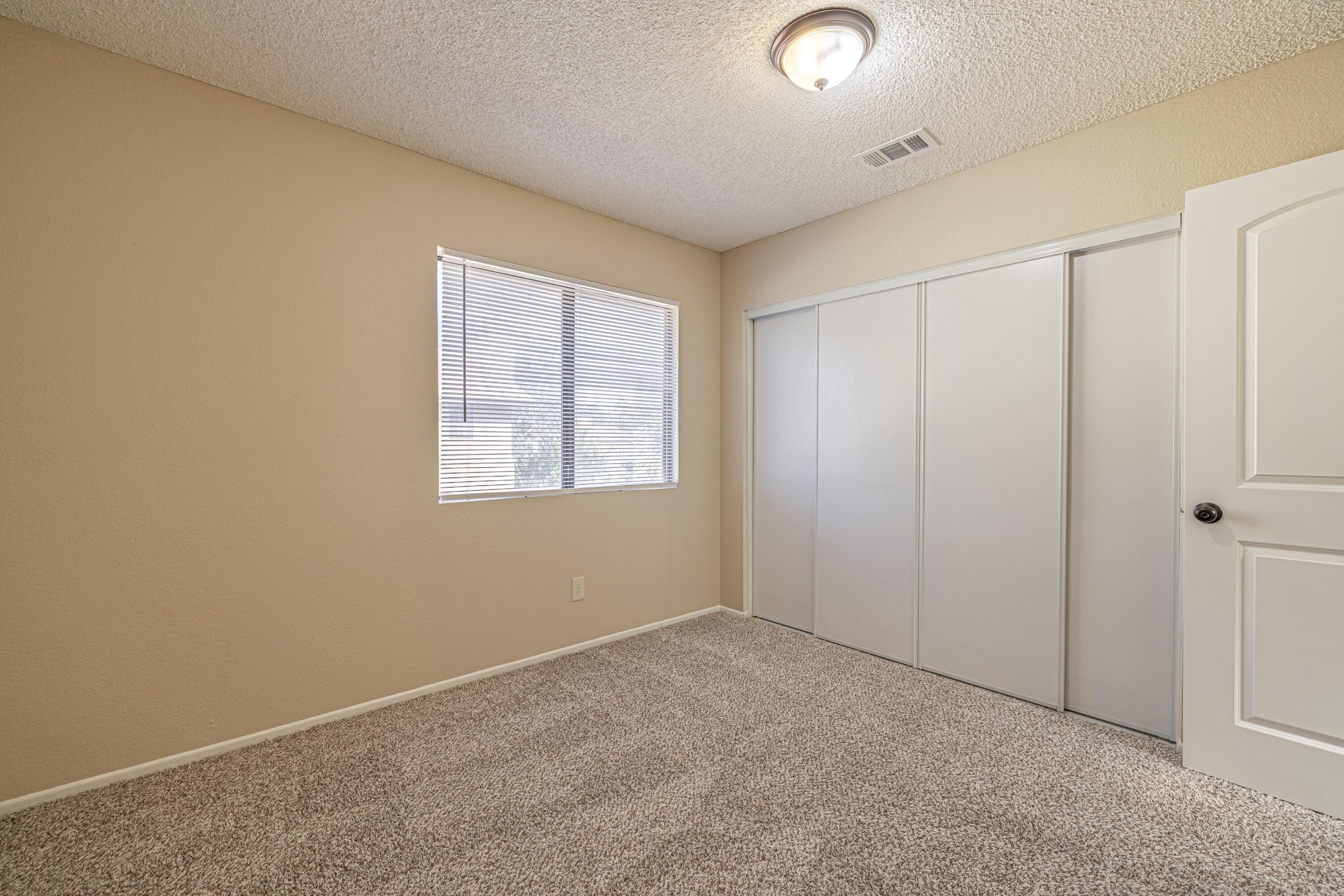 533 East Jackman Street Lancaster, CA 93535 - Photo 25 of 31 an empty room with windows and closet