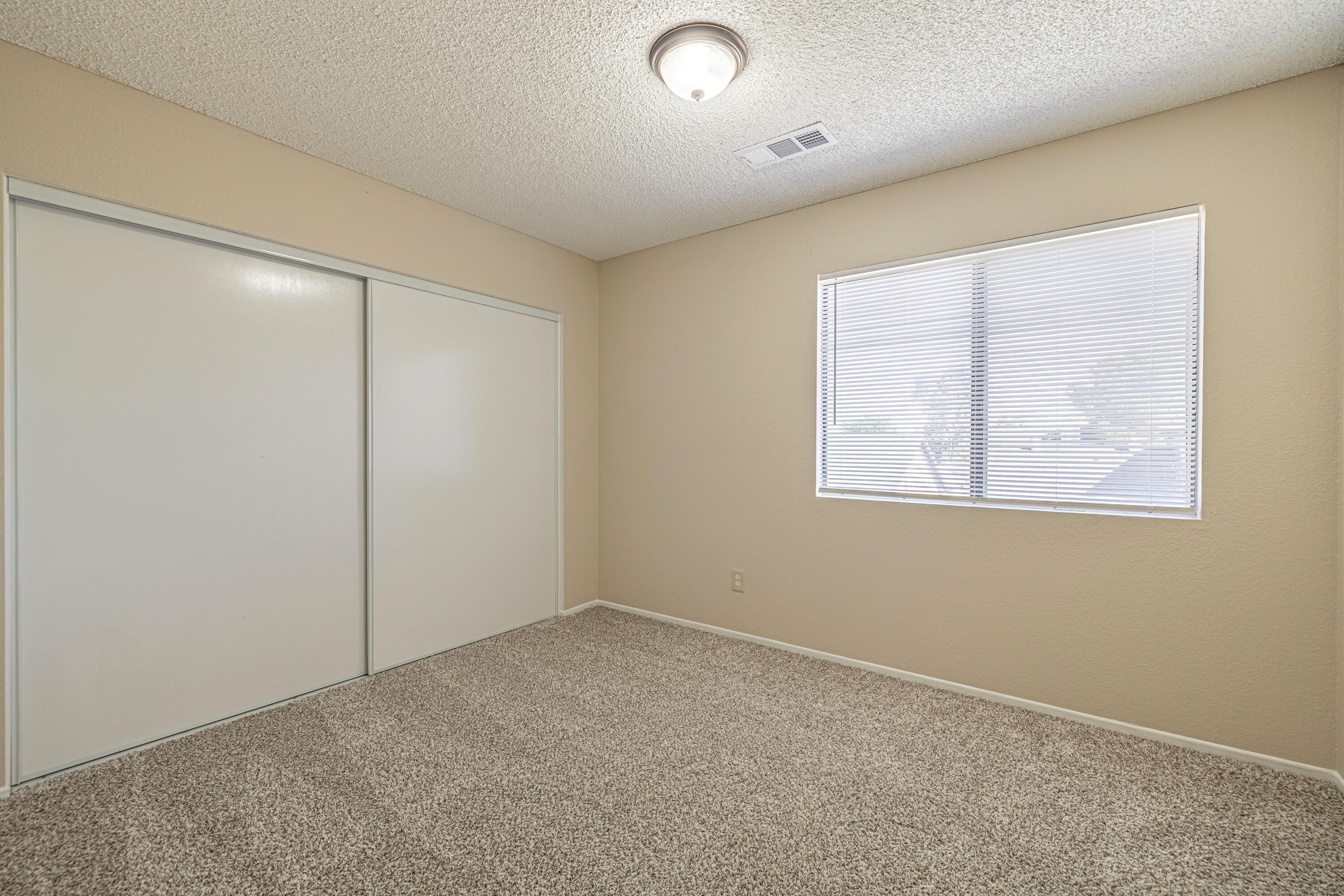 533 East Jackman Street Lancaster, CA 93535 - Photo 27 of 31 an empty room with windows and closet