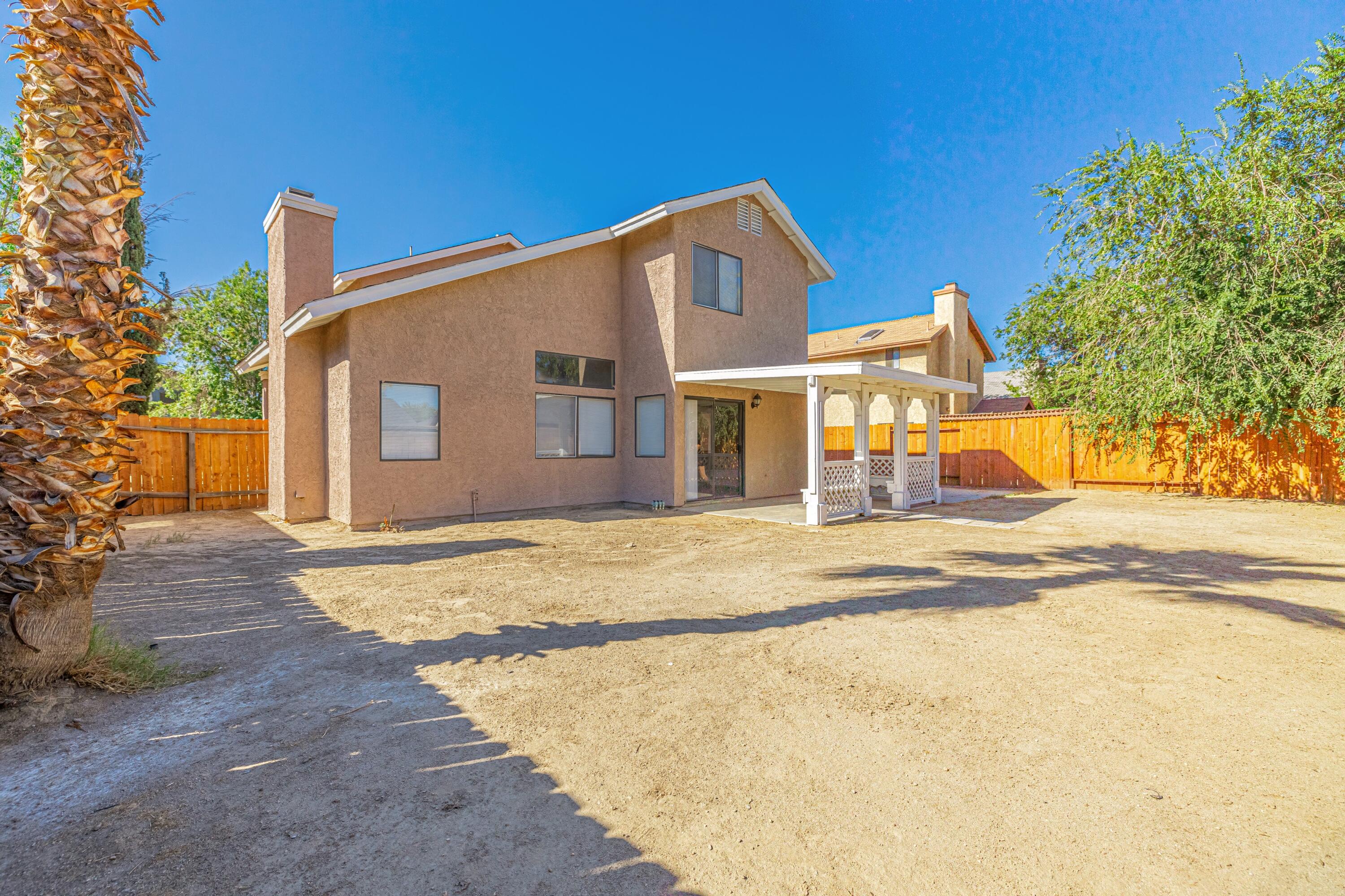 533 East Jackman Street Lancaster, CA 93535 - Photo 31 of 31 a view of a house with a yard