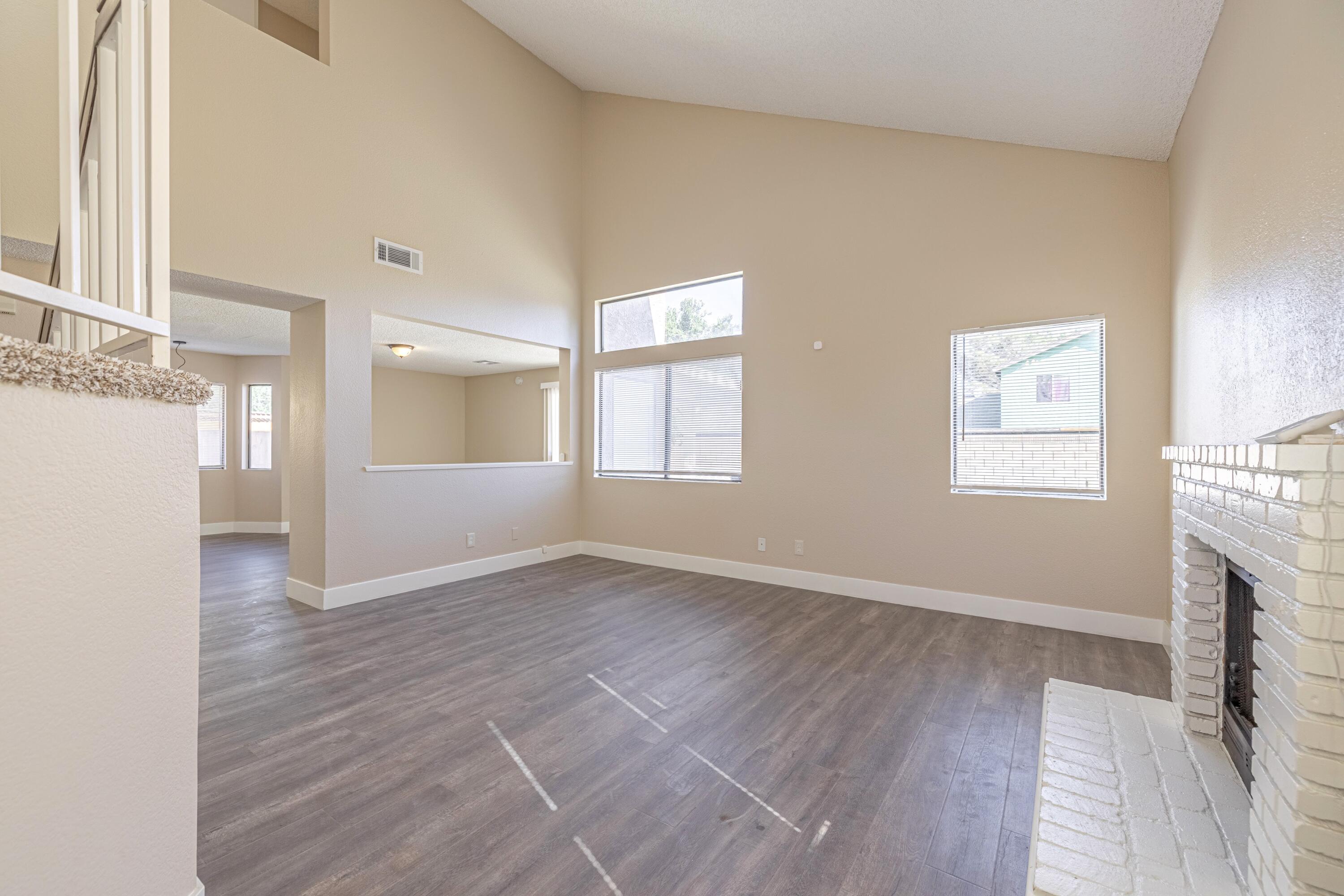 533 East Jackman Street Lancaster, CA 93535 - Photo 5 of 31 wooden floor in an empty room with a window