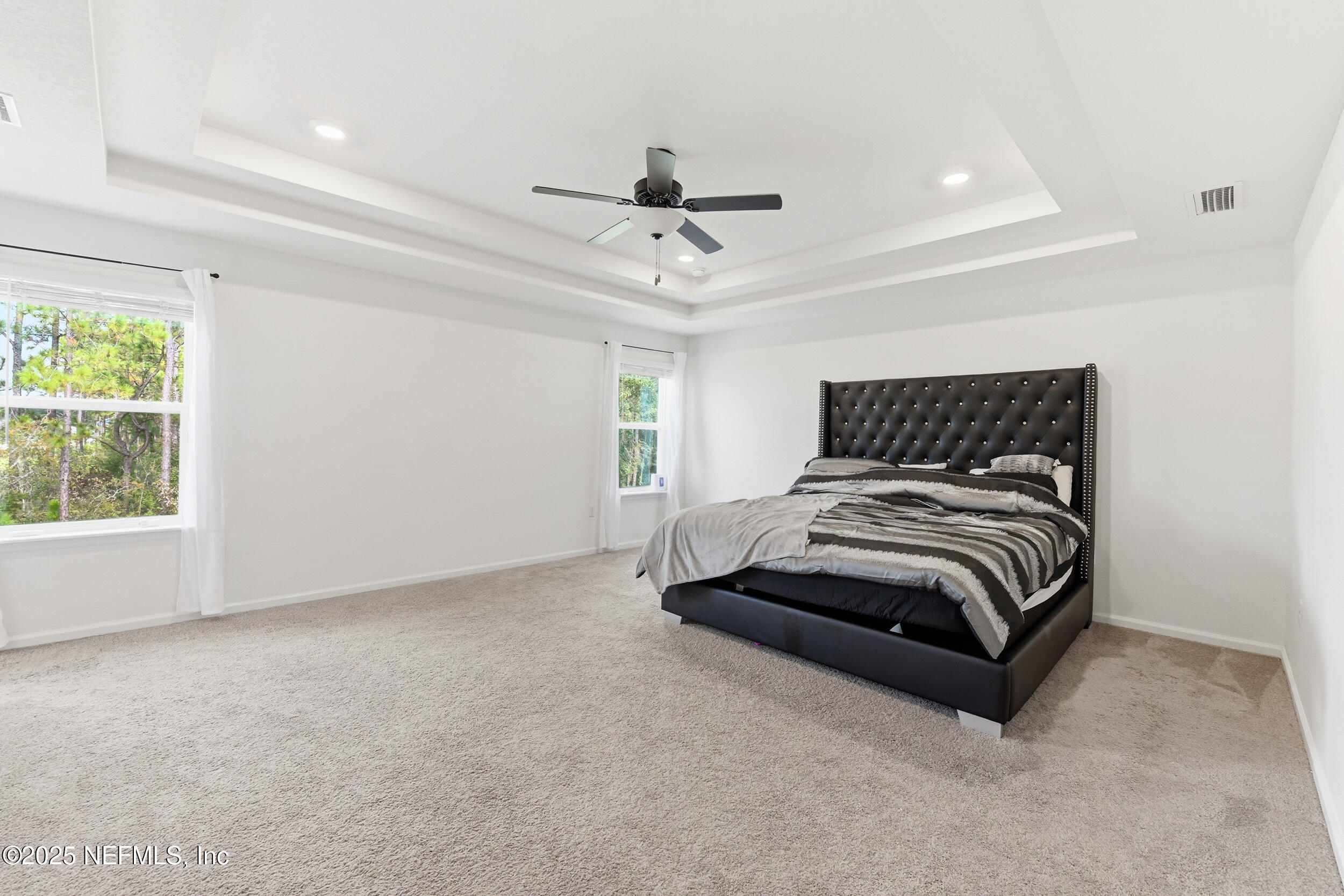 11183 Stapleton Drive Jacksonville, FL 32222 - Photo 14 of 43 a bedroom with a bed and window