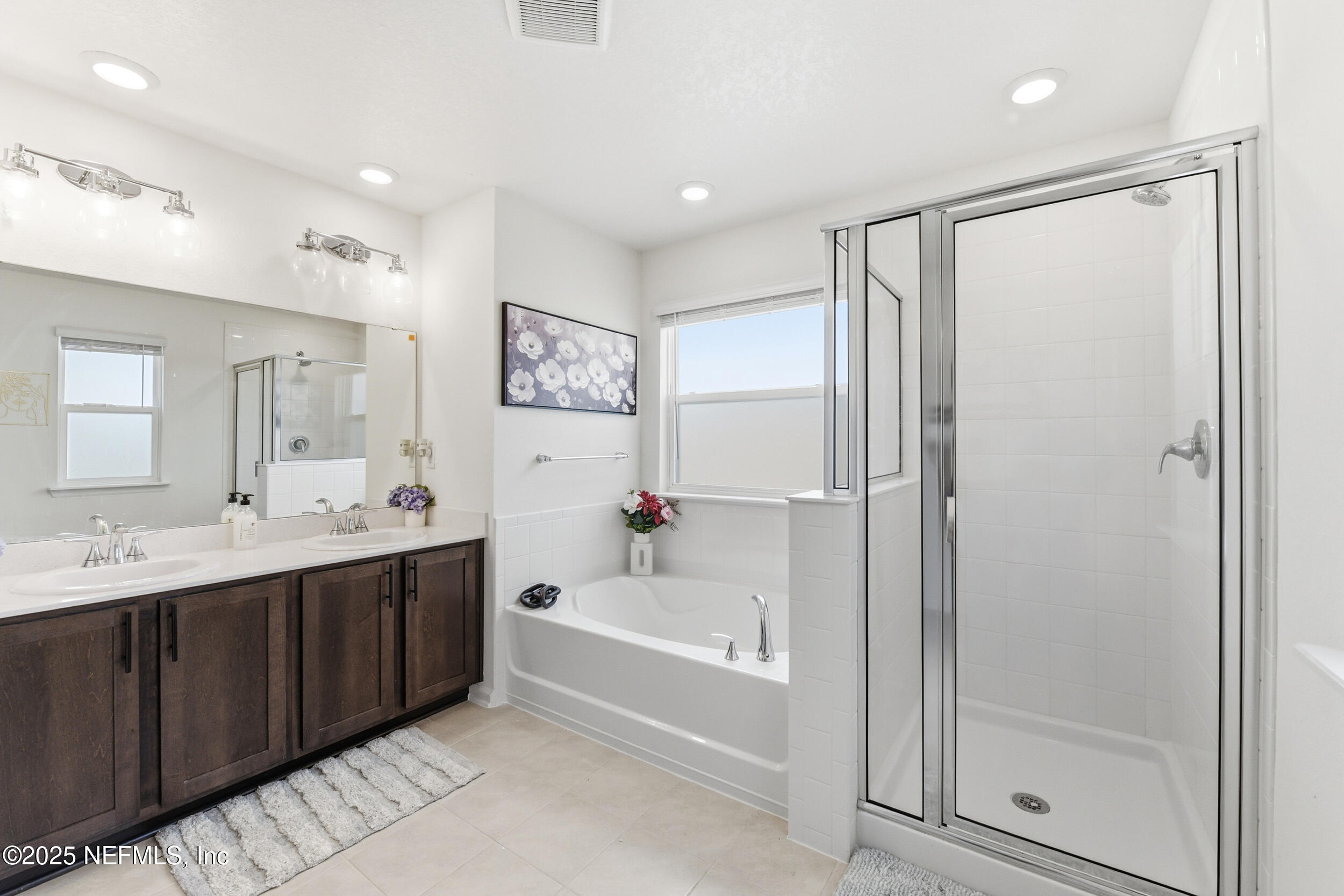 11183 Stapleton Drive Jacksonville, FL 32222 - Photo 15 of 43 a bathroom with a tub a sink and mirror