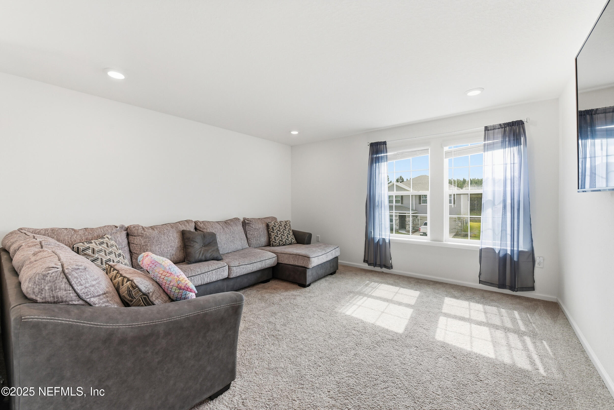 11183 Stapleton Drive Jacksonville, FL 32222 - Photo 22 of 43 a living room with furniture and a large window