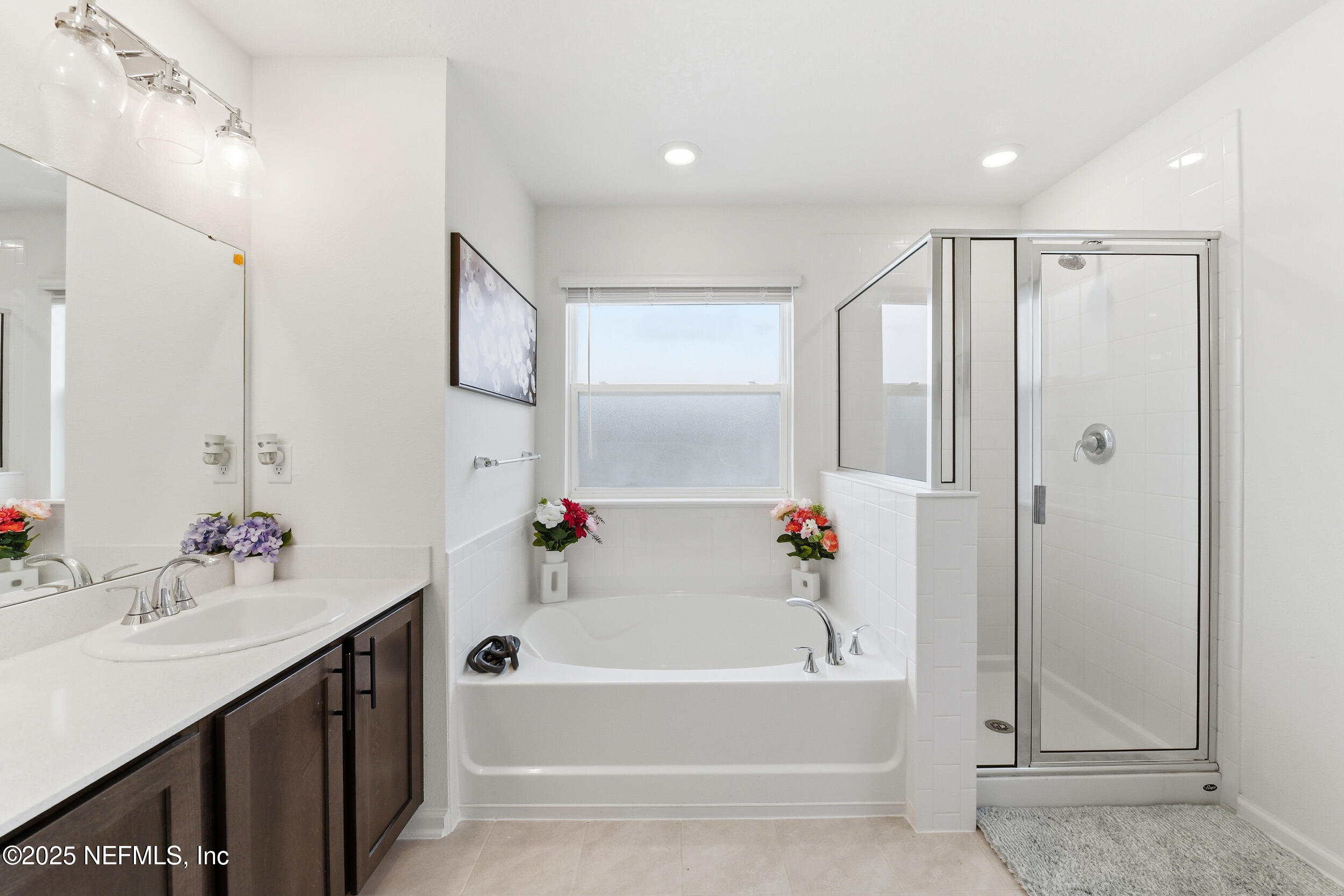 11183 Stapleton Drive Jacksonville, FL 32222 - Photo 27 of 43 a bathroom with a bathtub a shower a sink and a mirror