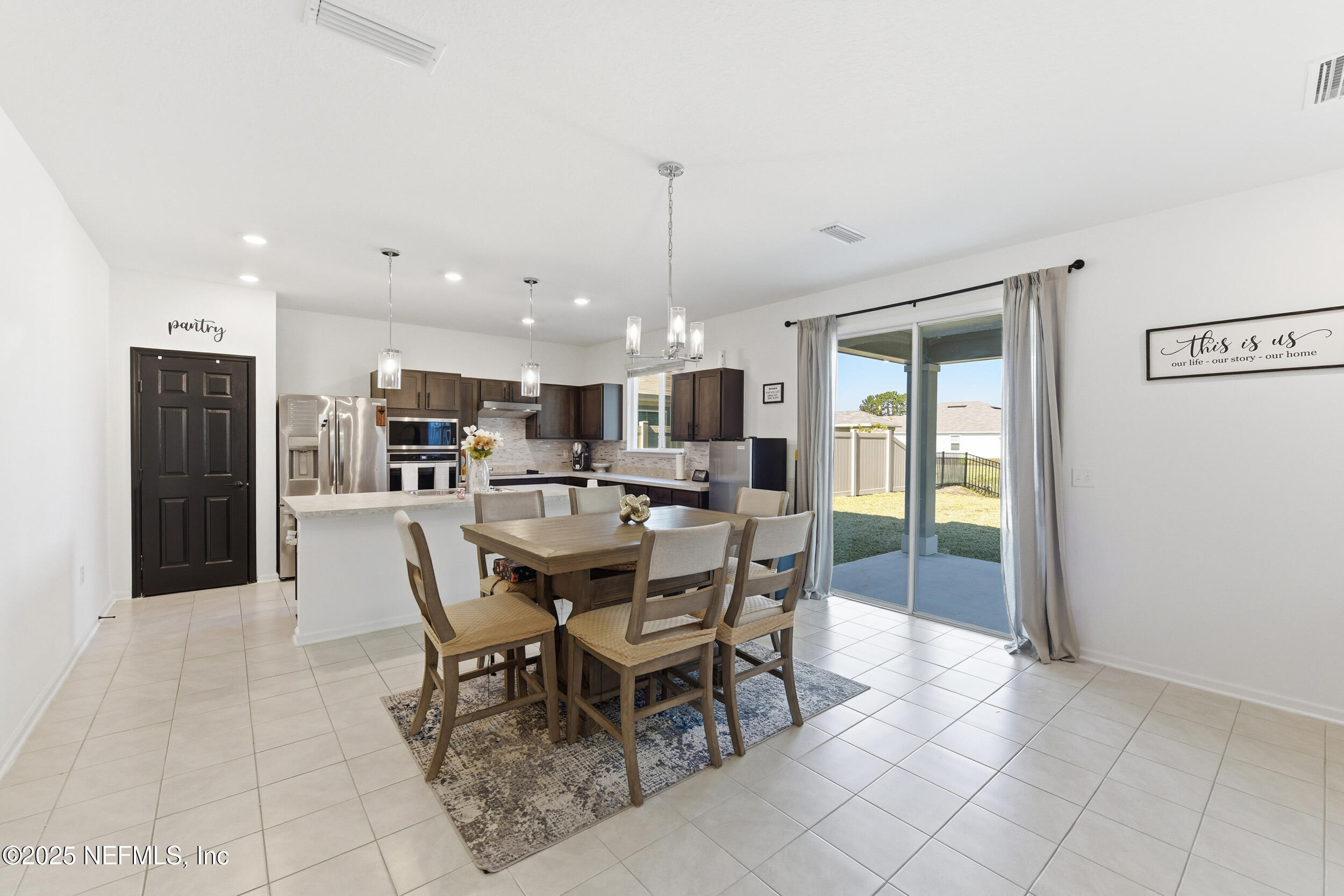 11183 Stapleton Drive Jacksonville, FL 32222 - Photo 9 of 43 a view of a dining room with furniture